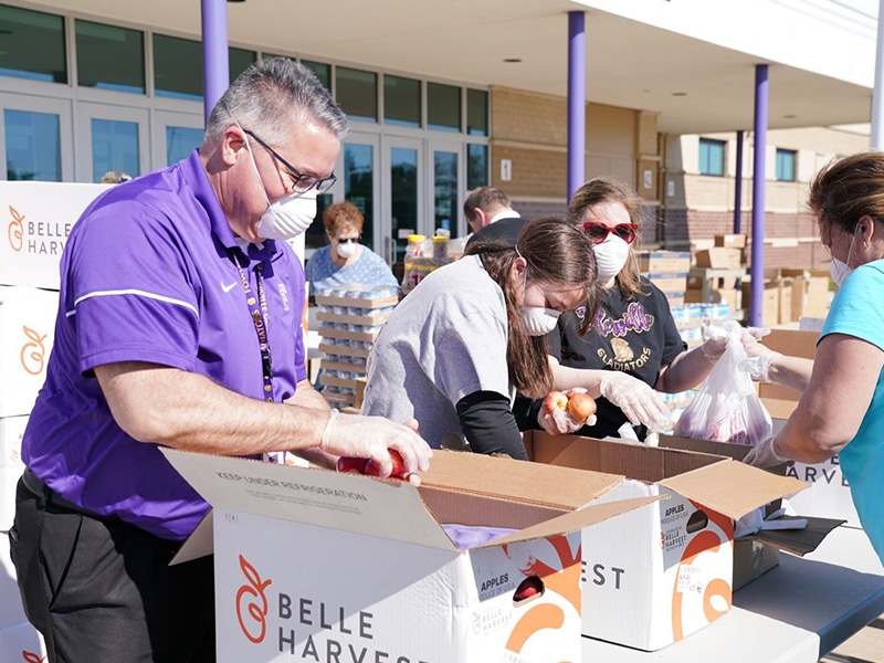Wayne Roedel, Fowlerville Community Schools Superintendent, volunteers at the Gleaners mobile food distribution