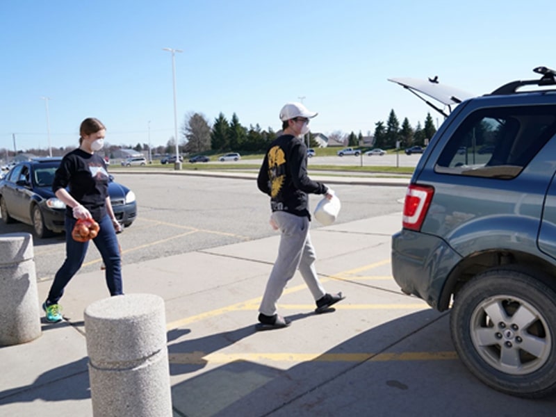 Students providing groceries