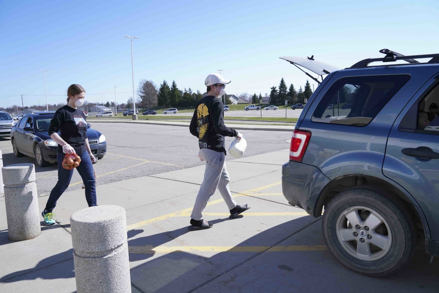 Drive-up food distribution at Fowlerville High School