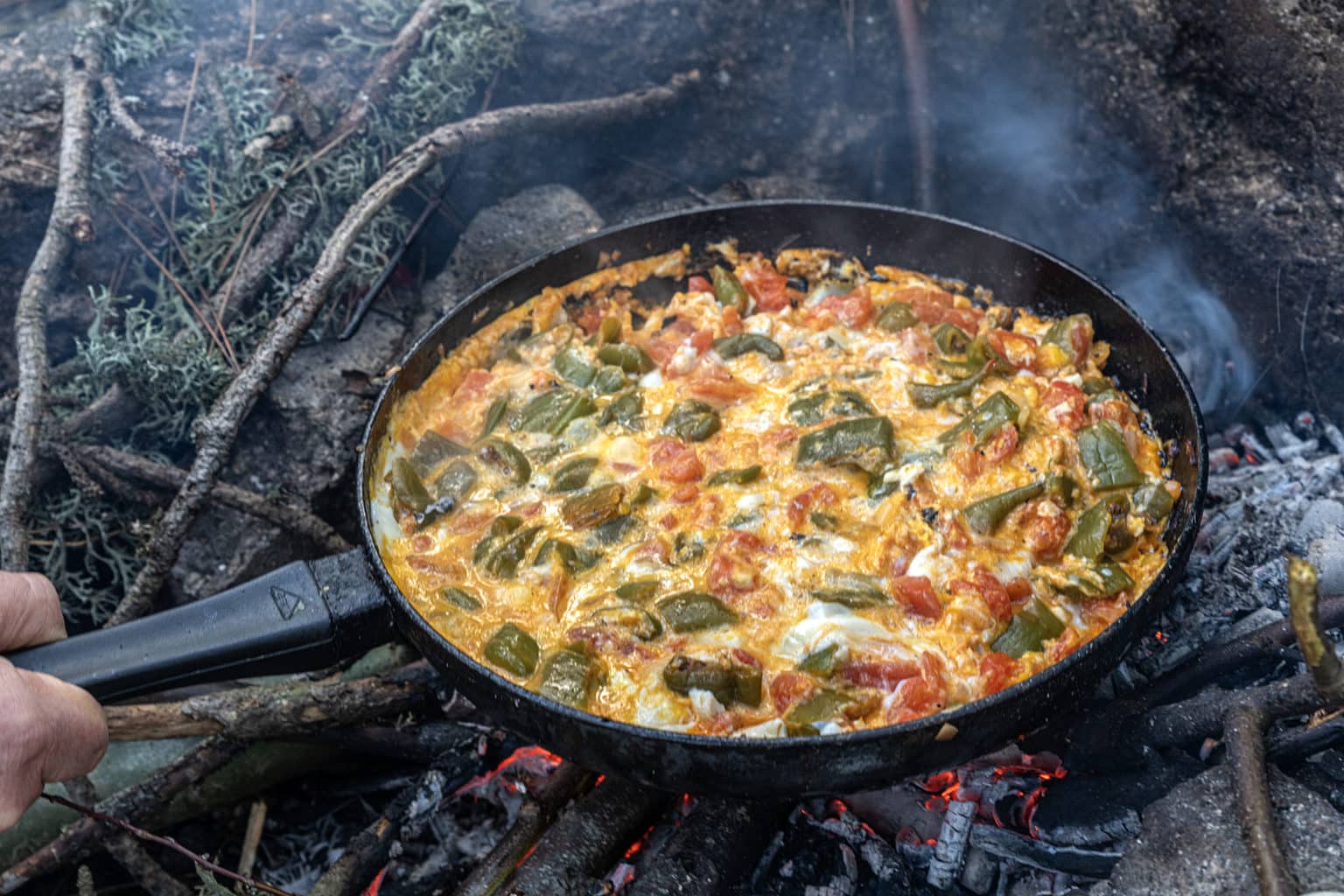Menemen, tomatoes, peppers, eggs, cooked for breakfast on the campfire