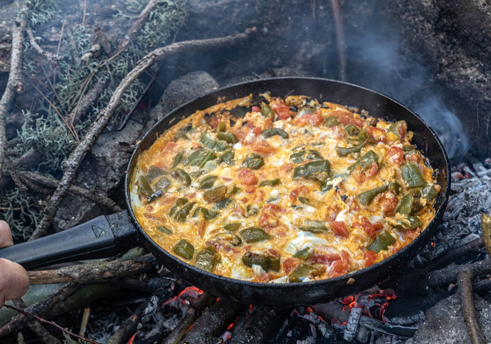 Menemen, tomatoes, peppers, eggs, cooked for breakfast on the campfire